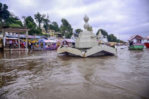 A partially submerged temple on the banks of the Narmada