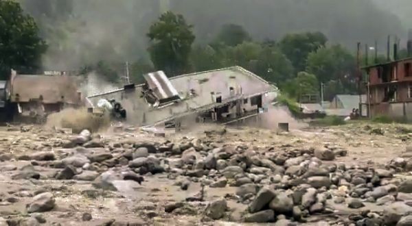 A hotel gets washed away in raging waters in Manali
