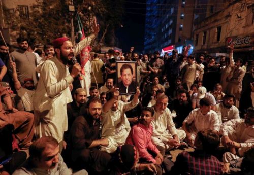 Imran Khan's supporters outside his home. REUTERS/Akhtar Soomro