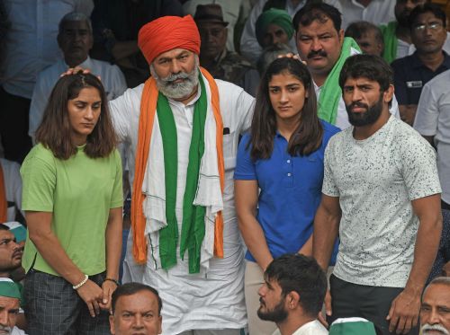 Rakesh Tikait with wrestlers last month