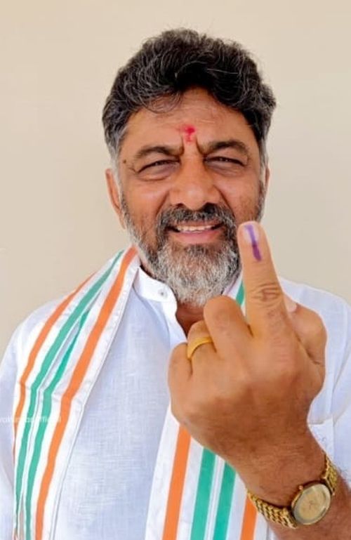 DK Shivakumar shows his finger