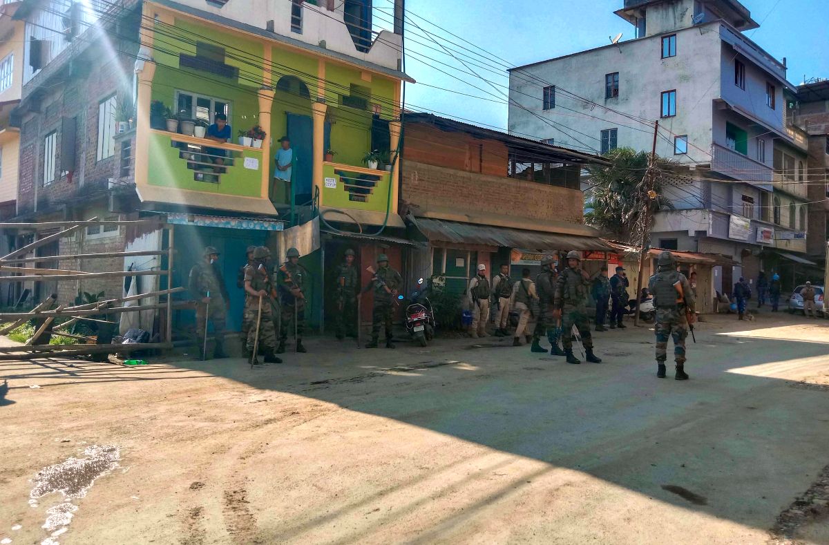 Army jawan stand guard in violence-hit area of Imphal town/PTI