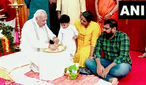 Kerala Governor Arif Mohammed Khan helps a child write his first letters on Vijayadashmi/ANI on X
