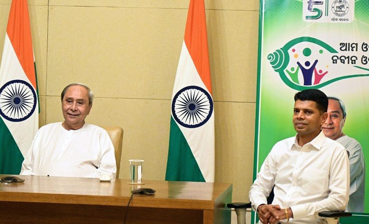 Odisha CM Naveen Patnaik with his former aide V K Pandian (right)
