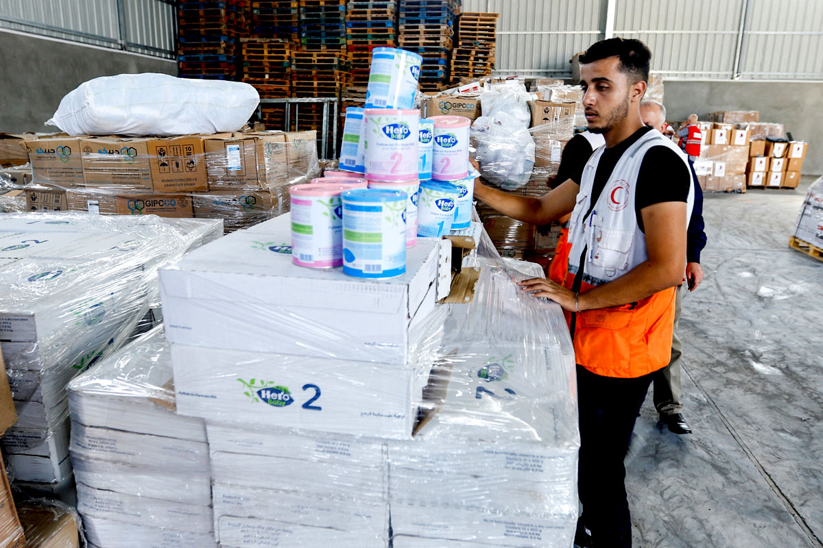 A Red Crescent worker sorts aid. Ibraheem Abu Mustafa/Reuters