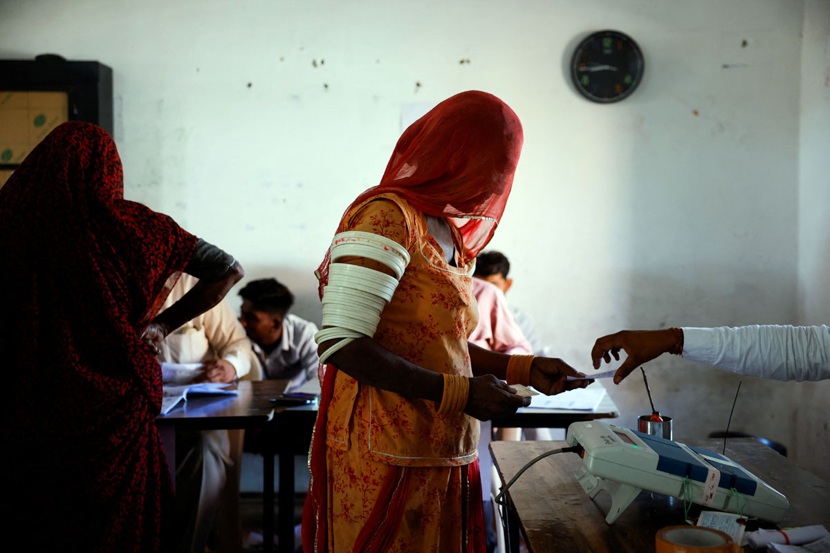A woman votes at a polling station during the second phase of LS elections, in Barmer, Rajasthan/Adnan Abidi/Reuters