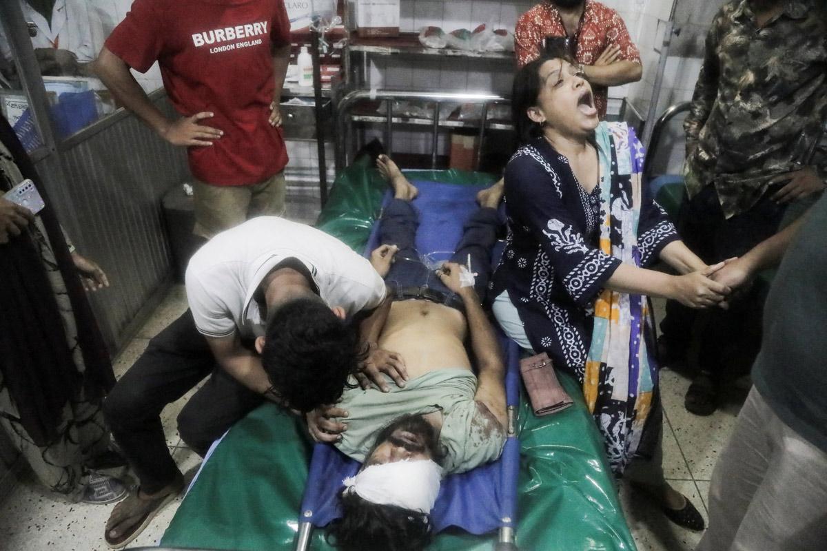 Relatives of a man who died in the protests. Pic: Stringer/Reuters