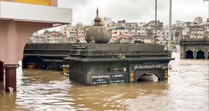 Temples got partially submerged in the Godavari river