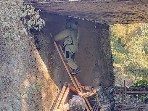 A jawan removing explosives from under a bridge in Manipur/ANI Photo