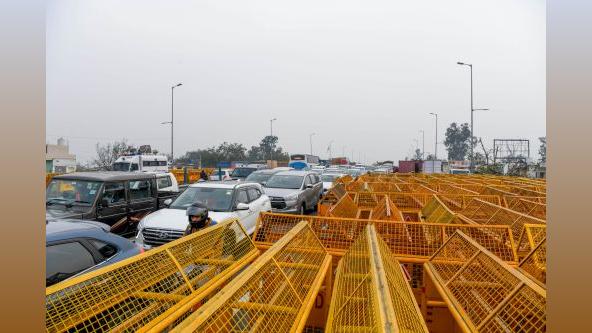 Barriers blockade the roads at the Singhu border