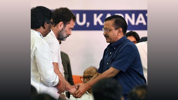 Congress leader Rahul Gandhi shakes hands with Delhi CM Arvind Kejriwal, in Bengaluru, July 18, 2023/ANI Photo