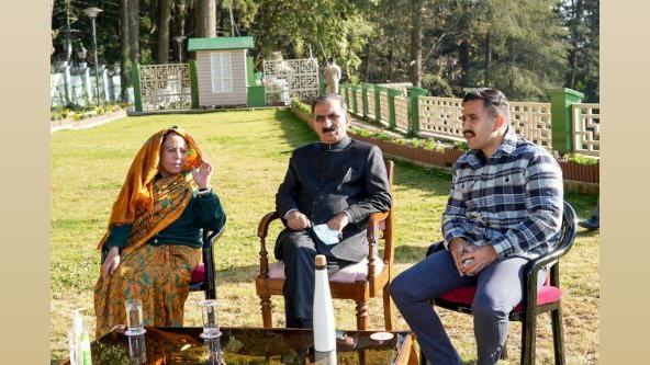 The Himachal CM with the Singhs. File pic