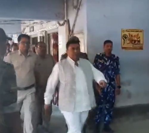 Shajahan Sheikh arrives at a police station