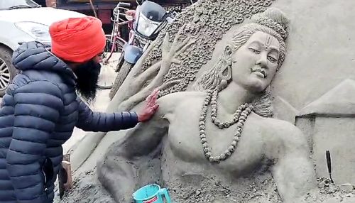 An artist works on a sculpture of Lord Ram in Ayodhya