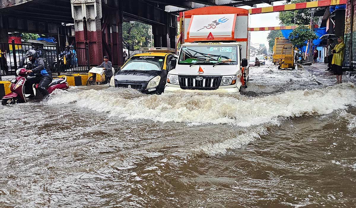 Vehicles wade through a waterlogged King Circle area, in Mumbai/ANI Photo