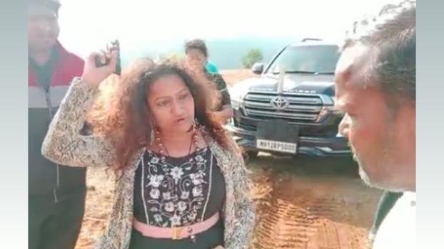 Manorama Khedkar brandishing a gun. She is wanted in a land dispute case