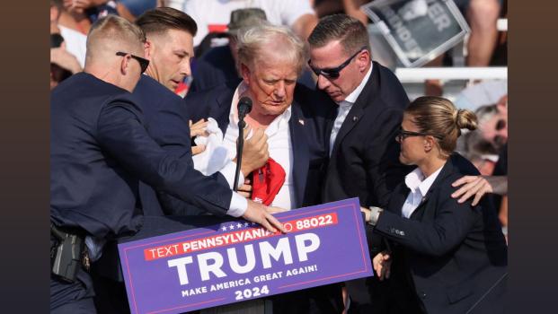 Former US President Donald Trump after being attacked by gunman/Brendan McDermid/Reuters