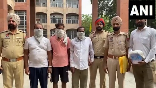 Police with the arrested drug smugglers in Amritsar/ANI on X