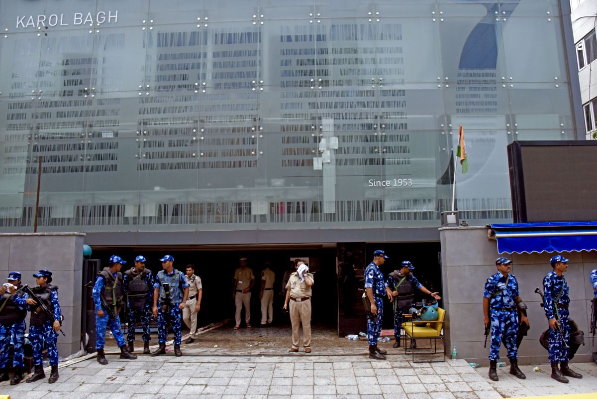 RAF and police personnel stand guard outside the Rao IAS Study Centre