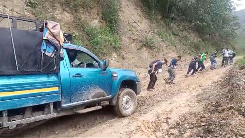 A polling team traverses difficult terrain in E Kameng, Arunachal