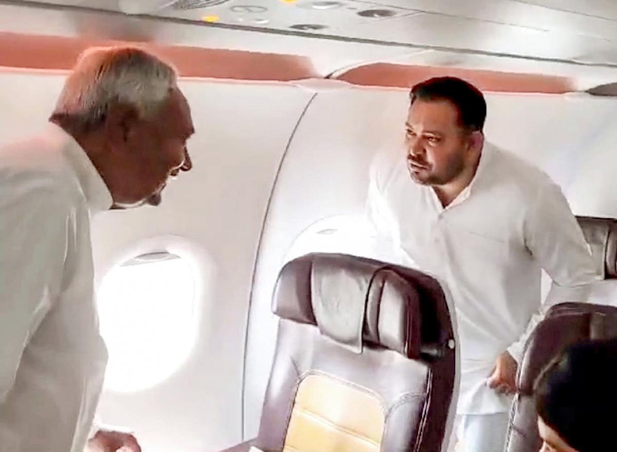 Nitish Kumar and Tejashwi Yadav on board a flight