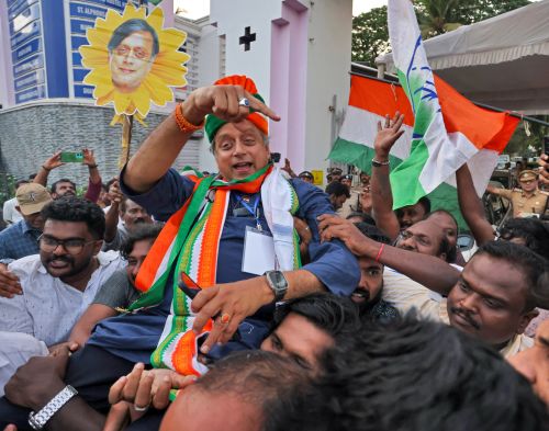 Shashi Tharoor celebrates his cliffhanger win