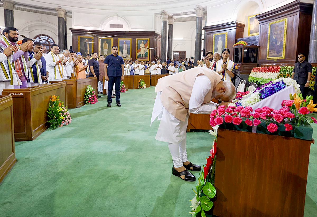 Narendra Modi bows before the Constitution