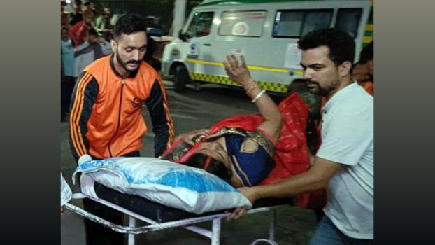 An injured pilgrim being taken to hospital in Reasi