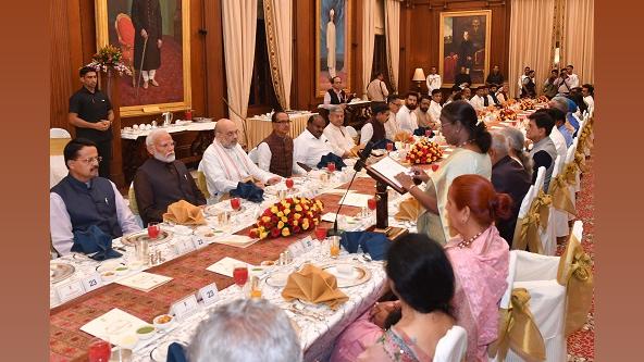 President Droupadi Murmu hosts a dinner in honour of the Union Council of Ministers, led by PM Narendra Modi/ANI Photo