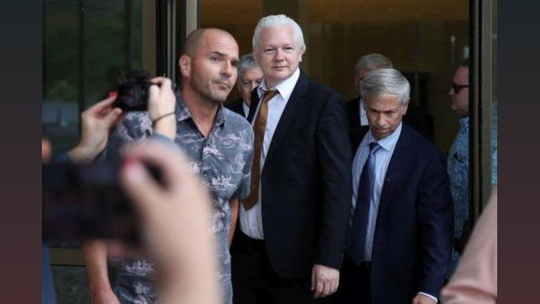 Julian Assange leaves a court in Saipan. @Stella_Assange
