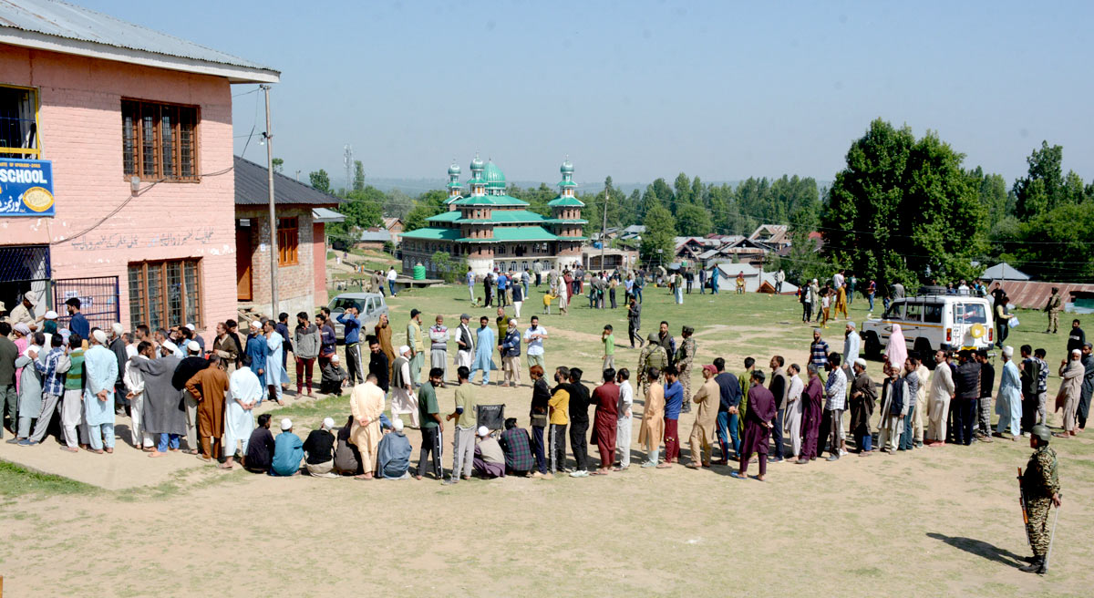 Voters standing in queue in Baramulla/Umar Ganie/Rediff.com
