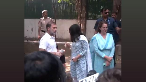 Congress MP Rahul Gandhi and Priyanka Gandhi Vadra wait outside a polling booth in New Delhi/ANI on X