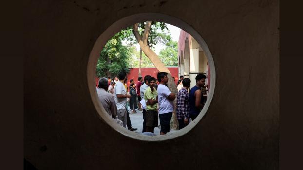 Voters line up to cast their votes outside a polling station in Sonipat, Haryana, May 25, 2024. Anushree Fadnavis/Reuters