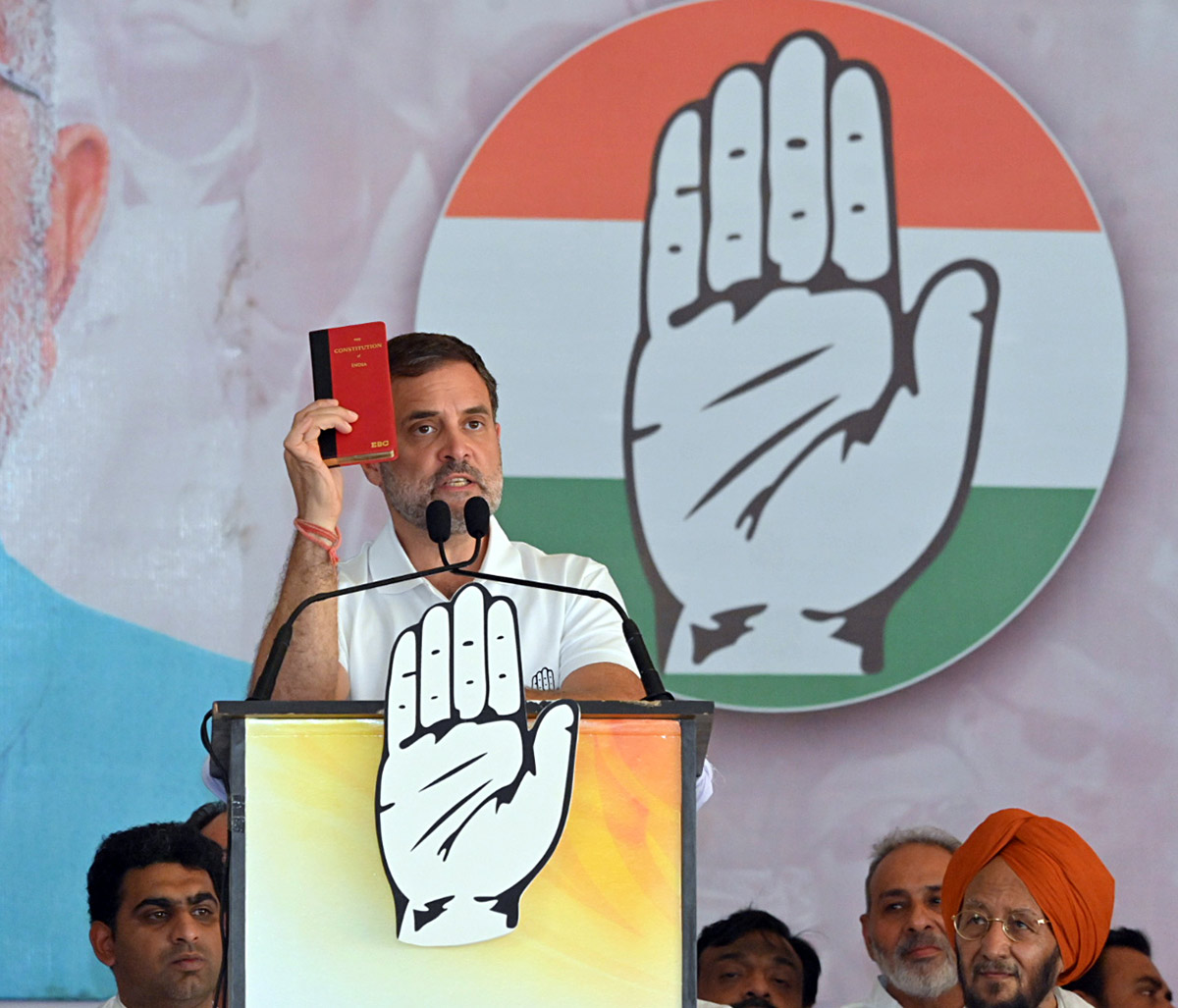 Rahul Gandhi holds up the Constitution at a rally