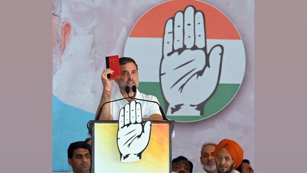 Rahul Gandhi holds up the Constitution at a rally