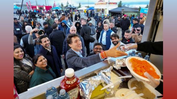 The Canada PM buys jalebi at Brampton during Diwali. Arlyn McAdorey/Reuters