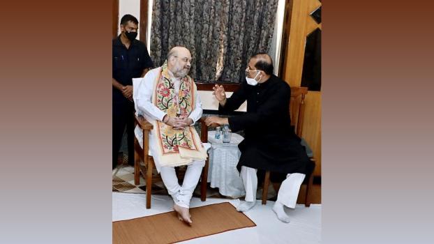 Pt Ajoy Chakrabarty with Amit Shah. File pic