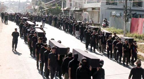 The empty coffin march by the Kukis. File pic