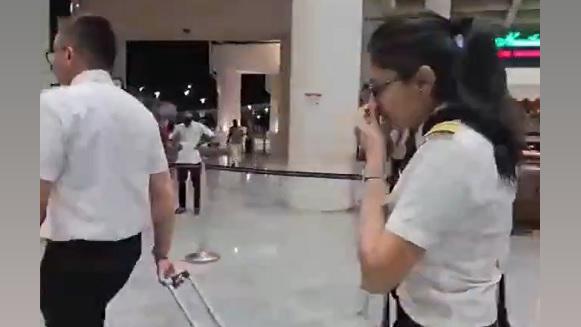 AI Express flight's pilot Iqrom Rifadly Fahmi Zainal and co-pilot Maitryee Shrikrishna Shitole leave Tiruchirapalli airport/ANI on X
