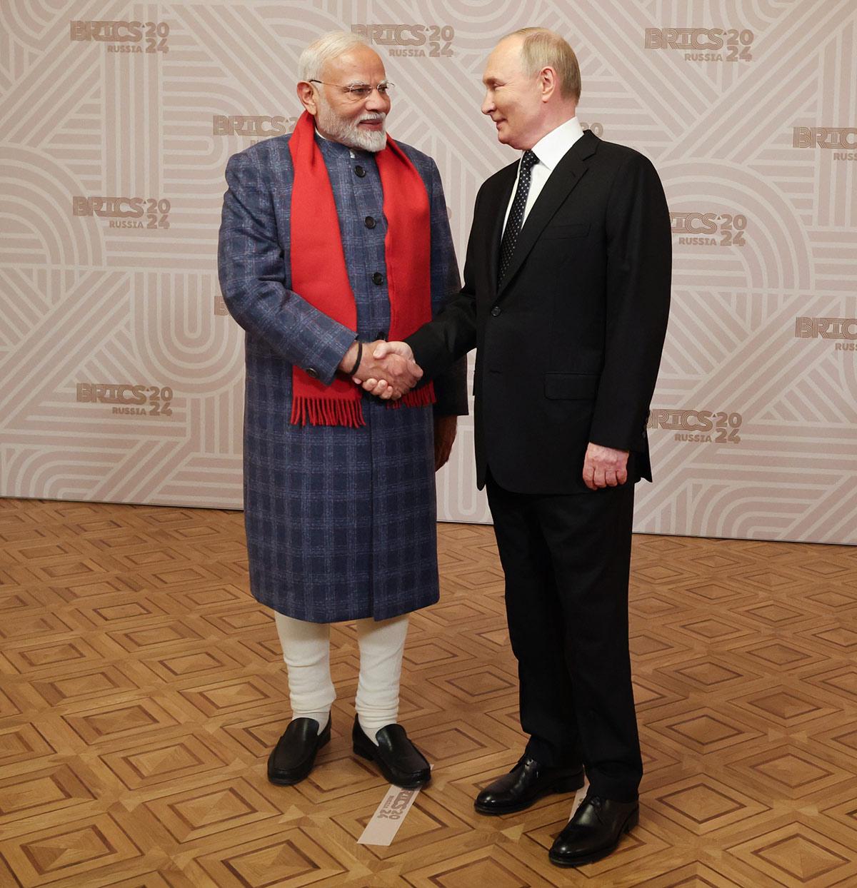 The President of Russian Federation, Mr. Vladimir Putin welcomes Prime Minister Narendra Modi at the dinner hosted for BRICS leaders at Kazan, in Russia on October 22, 2024.