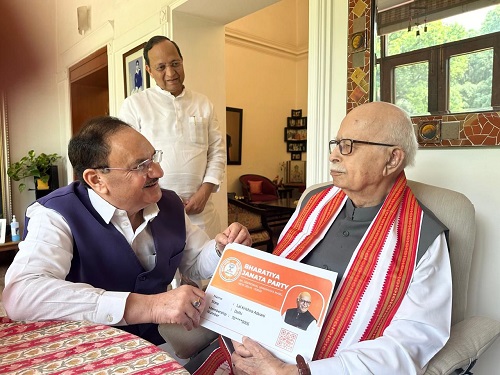 BJP chief JP Nadda hands over party membership certificate to veteran party leader LK Advani in New Delhi/ANI on X