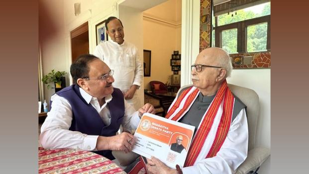 BJP chief JP Nadda hands over party membership certificate to veteran party leader LK Advani in New Delhi/ANI on X