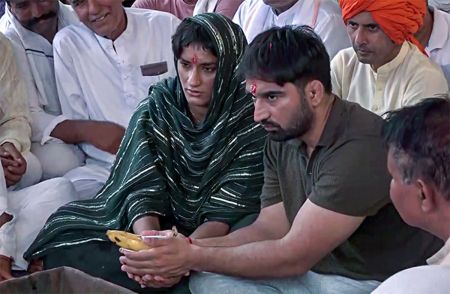 Congress Julana candidate Vinesh Phogat takes part in a havan at the inauguration of the party's election office, at Julana in Jind