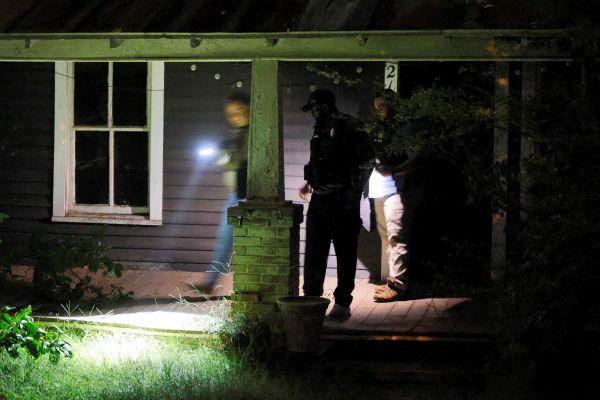 FBI agents check the suspect's house. Reuters/Jonathan Drake