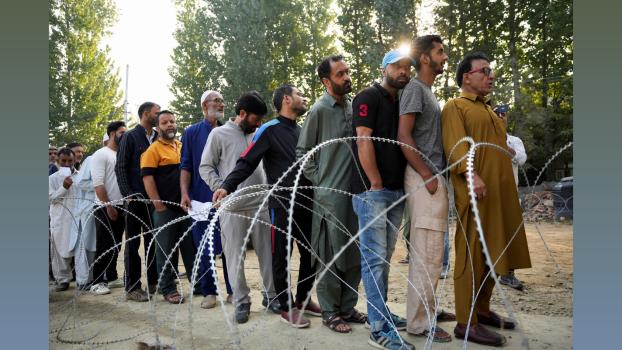 Voters stand in queue at Budgam. Sanna Irshad Mattoo/Reuters