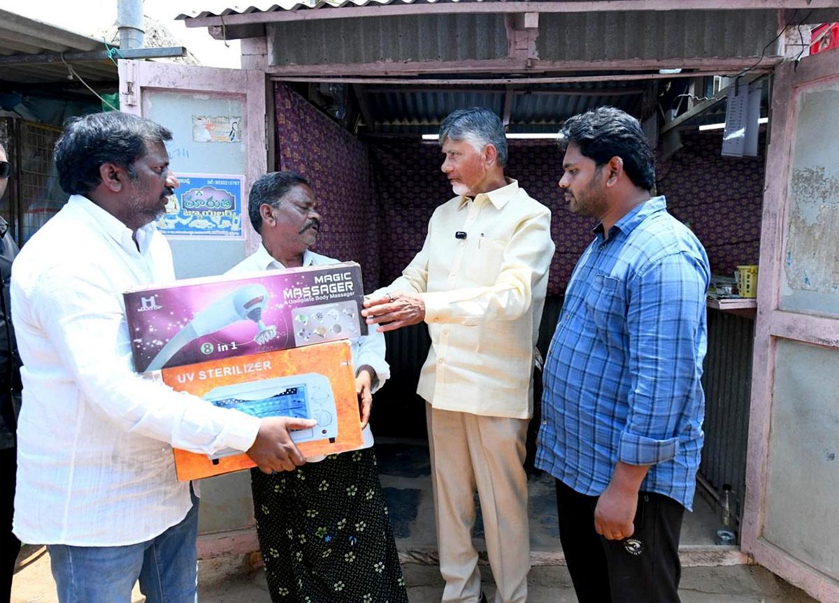 Andhra Pradesh Chief Minister N Chandrababu Naidu feeds a buffalo Andhra Pradesh Chief Minister N Chandrababu Naidu feeds a buffalo