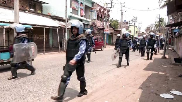 Security personnel hold a flag march at Dhuliyan/ANI Photo