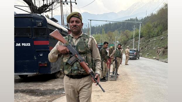Cops keep vigil at a check point after terrorists attack in Pahalgam/Reuters