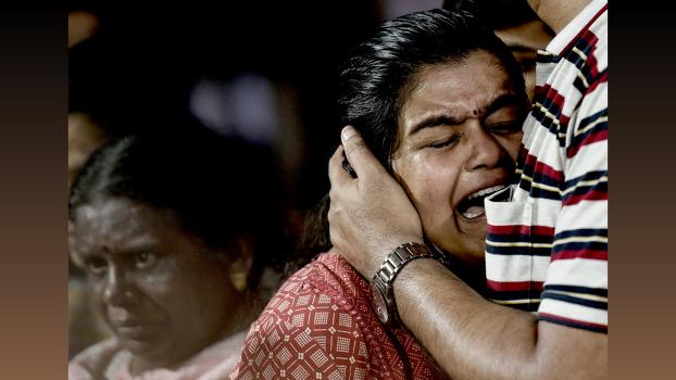 Family members of Sanjay Lele mourn his death