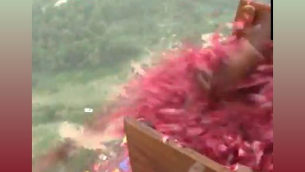 Flower petals being showered on devotees from a chopper in UP